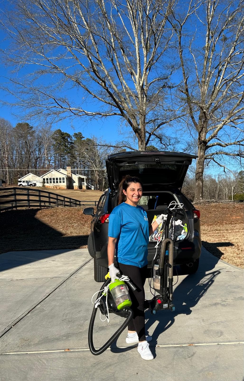 Valeria Guimaraes of Blue Maids ready for a residential cleaning visit in Alpharetta